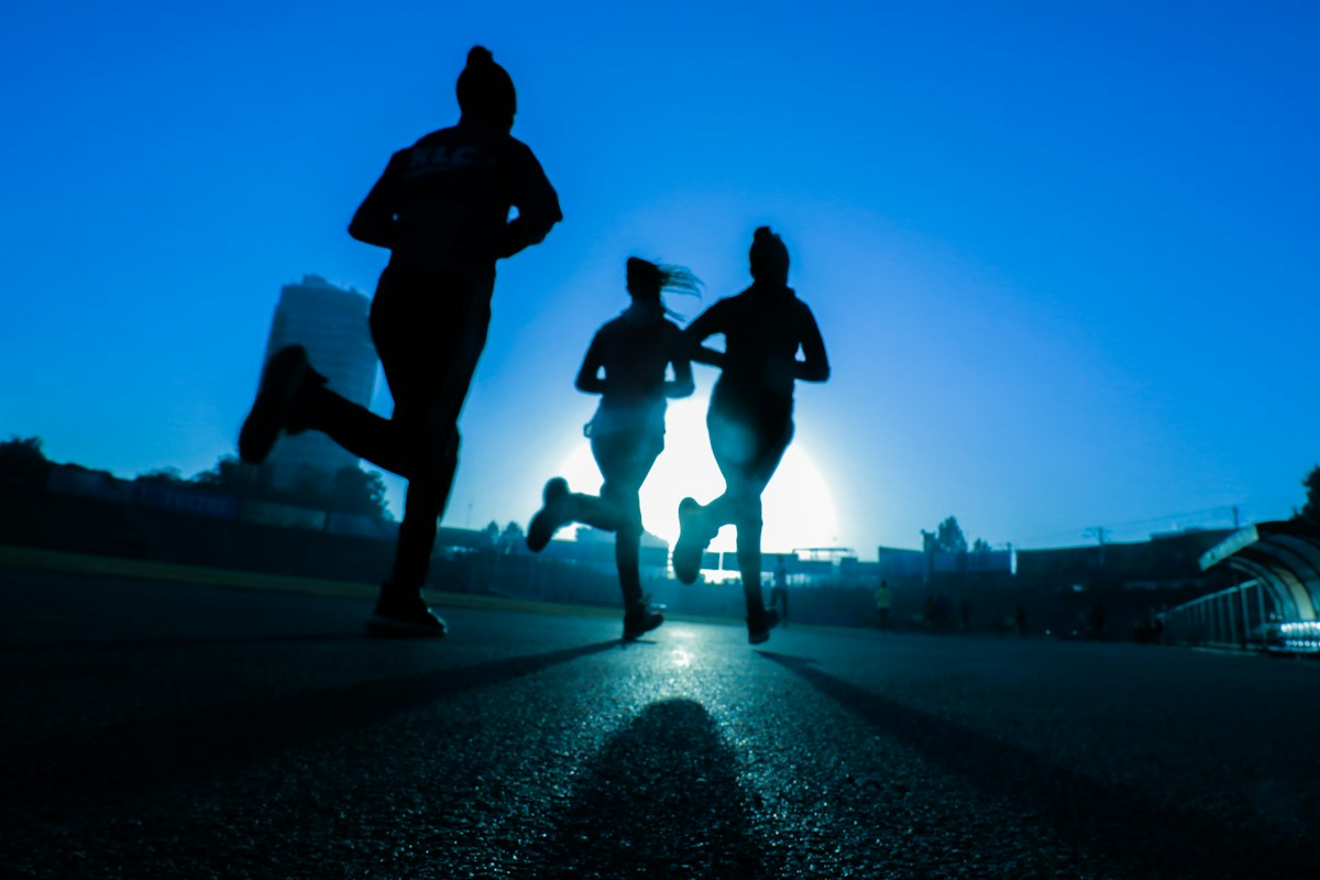 Employee running outdoors for a distance challenge